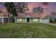 Charming, green single-story home featuring a well-maintained lawn and neutral-toned roof at 5105 W Cleveland St, Tampa, FL 33609
