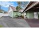 Charming home exterior featuring a covered carport and well-maintained landscaping at 5105 W Cleveland St, Tampa, FL 33609