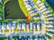 Aerial view showcasing home's location near a pond, the community, and nearby streets at 5850 Silverside Pine Ct, Bradenton, FL 34211