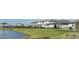 View of homes with water in the backyard at 5850 Silverside Pine Ct, Bradenton, FL 34211
