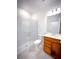 This bathroom features a glass shower, toilet, vanity with sink, and a neutral color palette at 5850 Silverside Pine Ct, Bradenton, FL 34211