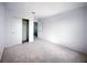 A cozy bedroom features plush carpet, a closet with sliding doors, and a neutral color palette at 5850 Silverside Pine Ct, Bradenton, FL 34211