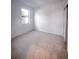 Bright bedroom with carpeted floors, neutral wall paint, window, and closet at 5850 Silverside Pine Ct, Bradenton, FL 34211