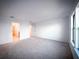 Spacious carpeted bedroom with ample natural light from the window and multiple doorways at 5850 Silverside Pine Ct, Bradenton, FL 34211