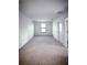 Bedroom featuring soft carpet, neutral wall paint, and a single window for natural light at 5850 Silverside Pine Ct, Bradenton, FL 34211