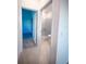 The view from the hallway features an adjacent bedroom and a bathroom with a glass shower at 5850 Silverside Pine Ct, Bradenton, FL 34211