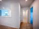Hallway with plush carpet, connecting various rooms, with great overhead lighting at 5850 Silverside Pine Ct, Bradenton, FL 34211