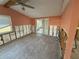 Living room showcasing vaulted ceiling and sliding glass door at 6241 Seabreeze Dr, Port Richey, FL 34668