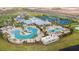 Stunning aerial view of the resort-style community pool with splash pad and play areas at 6274 Broad Field Ave, Apollo Beach, FL 33572