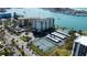 Condo building with community amenities like pool and tennis courts offer a luxurious waterfront lifestyle at 660 Island Way # 202, Clearwater Beach, FL 33767