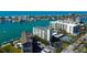 High rise condo building with community pool, tennis, and waterfront with bay and Gulf views at 660 Island Way # 202, Clearwater Beach, FL 33767