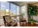Cozy balcony seating area with beautiful views of the city and palm trees at 660 Island Way # 202, Clearwater Beach, FL 33767