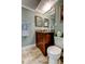 Bathroom featuring granite counters, decorative mirrors and nice fixtures for an upgraded look at 660 Island Way # 202, Clearwater Beach, FL 33767