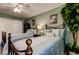 Bedroom with two beds, ceiling fan, a large window, and closet doors at 660 Island Way # 202, Clearwater Beach, FL 33767