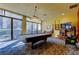 Spacious billiards room featuring a pool table, entertainment center, and comfortable seating at 660 Island Way # 202, Clearwater Beach, FL 33767