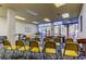 Community room with rows of chairs facing large windows offering ample light and views at 660 Island Way # 202, Clearwater Beach, FL 33767