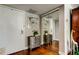 Elegant entryway with mirrored closet doors, decorative chest, and wood flooring at 660 Island Way # 202, Clearwater Beach, FL 33767