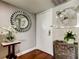 Stylish entryway features hardwood floors, decorative mirror, and modern accents at 660 Island Way # 202, Clearwater Beach, FL 33767