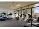 Well equipped fitness center with cardio machines, weight equipment, and large windows at 660 Island Way # 202, Clearwater Beach, FL 33767