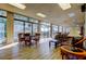 Bright and airy game room with large windows, table for cards, and plush seating area at 660 Island Way # 202, Clearwater Beach, FL 33767
