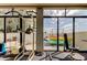 Indoor gym with weight training equipment, kayak storage, and access to outdoor activities at 660 Island Way # 202, Clearwater Beach, FL 33767