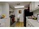 Efficient kitchen with stainless steel appliances, white cabinets, and ample counter space at 660 Island Way # 202, Clearwater Beach, FL 33767