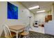 Functional laundry room with modern appliances, ample lighting, and a convenient folding area at 660 Island Way # 202, Clearwater Beach, FL 33767