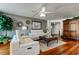 Comfortable living room featuring hardwood floors, soft lighting, and stylish decor at 660 Island Way # 202, Clearwater Beach, FL 33767