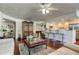 Spacious living room featuring bar kitchen and hardwood floors, perfect for entertaining at 660 Island Way # 202, Clearwater Beach, FL 33767