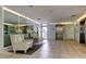 Bright lobby with tile flooring, mirror accent wall, elevator access, and comfortable seating area at 660 Island Way # 202, Clearwater Beach, FL 33767