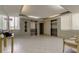 Apartment lobby with two elevators, neutral colored walls, and tiled flooring at 660 Island Way # 202, Clearwater Beach, FL 33767