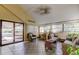 Sunroom with wicker furniture and tile floor at 660 Island Way # 202, Clearwater Beach, FL 33767