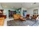 Relaxing community lounge with sofas, armchairs, a book case and decorative area rug at 660 Island Way # 202, Clearwater Beach, FL 33767
