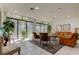 Inviting community lounge area with large windows, comfortable seating, and views of the surrounding landscape at 660 Island Way # 202, Clearwater Beach, FL 33767