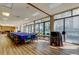 Bright meeting room with a long conference table and large windows overlooking the outdoors at 660 Island Way # 202, Clearwater Beach, FL 33767
