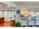 Office space that features hardwood floors and a view into the adjacent kitchen area at 660 Island Way # 202, Clearwater Beach, FL 33767
