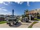 Community outdoor seating area with picnic tables and a tiki hut overlooking the marina at 660 Island Way # 202, Clearwater Beach, FL 33767
