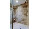 Tiled walk-in shower with built in niche and great fixtures at 660 Island Way # 202, Clearwater Beach, FL 33767