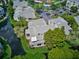 Scenic aerial view of upscale condos along a tranquil waterway and lush green landscape in a well-maintained community at 6907 Stonesthrow N Cir # 2102, St Petersburg, FL 33710