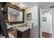 Stylish bathroom features a modern vanity, decorative mirror, and a shower/tub combination at 6916 Stones Throw N Cir # 9110, St Petersburg, FL 33710
