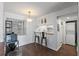 Eat-in kitchen features a breakfast bar with stools and views of laundry at 6916 Stones Throw N Cir # 9110, St Petersburg, FL 33710
