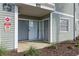 A covered patio with sliding glass doors and a no smoking sign at 6916 Stones Throw N Cir # 9110, St Petersburg, FL 33710