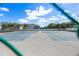Outdoor tennis courts with net and fences at 6916 Stones Throw N Cir # 9110, St Petersburg, FL 33710