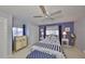 Inviting bedroom boasts carpet floors, ceiling fan, and ample closet space at 701 Baltusrol Way, Sun City Center, FL 33573