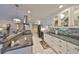 Modern kitchen with granite countertops, stainless steel appliances, and stylish backsplash at 701 Baltusrol Way, Sun City Center, FL 33573