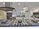 Kitchen with stainless steel appliances, granite countertops, and bar seating at 701 Baltusrol Way, Sun City Center, FL 33573