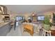 Spacious living space that connects the kitchen to the dining area with multiple seating arrangements at 701 Baltusrol Way, Sun City Center, FL 33573