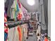 Well-organized walk-in closet with rods, shelves, and storage solutions for clothing, shoes, and accessories at 701 Baltusrol Way, Sun City Center, FL 33573