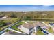 Aerial view of a beautiful home overlooking a pond and lush greenery at 7112 Samuel Ivy Dr, Tampa, FL 33619