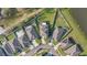 Stunning aerial view of a residential community with well-manicured lawns and a serene pond at 7112 Samuel Ivy Dr, Tampa, FL 33619